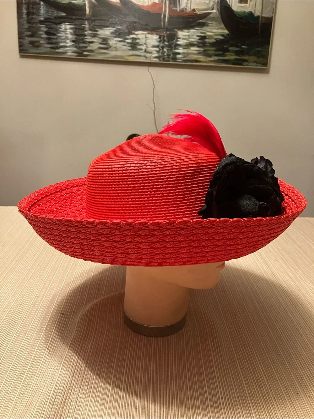 Red Straw Wide-Brimmed Hat with Black Velvet Floral and Red Feather Accents